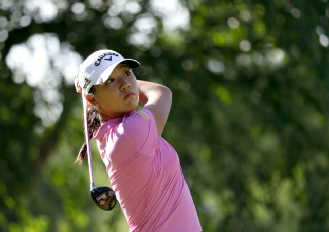 Lydia Ko of New Zealand hits her first shot on the 13th hole during the final round of the