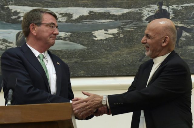 Afghan President, Ashraf Ghani (R) shakes hands with US Defence Secretary Ashton Carter in