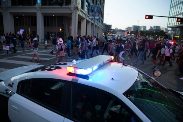Two police officers were shot during a rally in Dallas, part of demonstations in several c