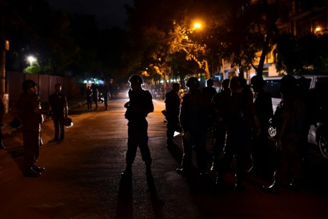 Bangladeshi security personnel stand guard after gunmen stormed a restaurant in Dhaka's hi