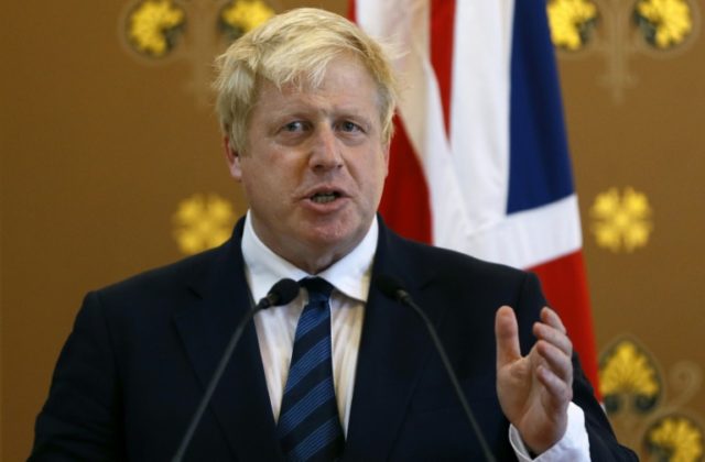 British Foreign Secretary Boris Johnson reacts as US Secretary of State John Kerry (not pi