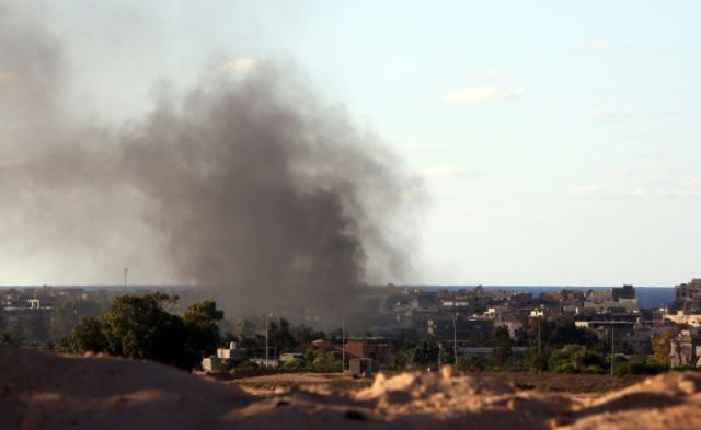 Smoke billows from buildings after the air force from the pro-government forces loyal to L