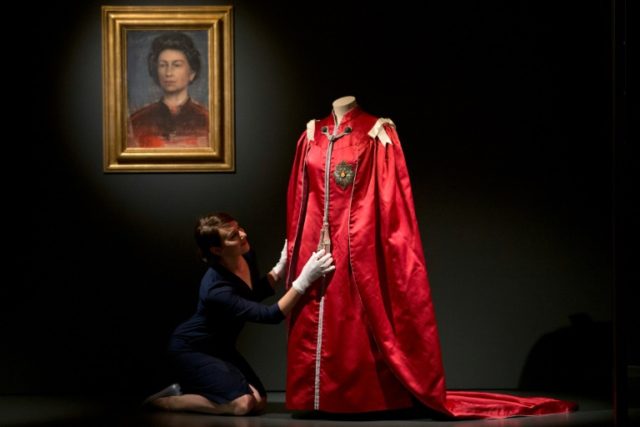 A picture shows exhibits on display at the "Fashioning a Reign: 90 Years of Style from The