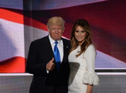 Presumptive Republican presidential candidate Donald Trump stands on stage with his wife Melania Trump following her address to delegates at the Republican National Convention in Cleveland, Ohio, on July 18, 2016