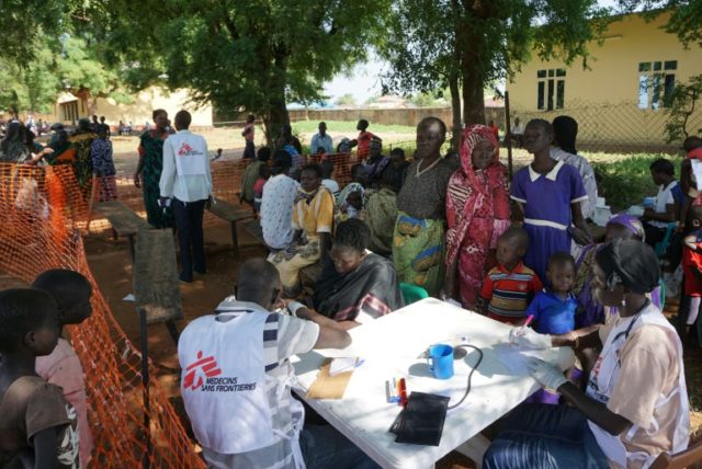 Medics from aid agency Doctors Without Borders (MSF) treat patients at a makeshift clinic