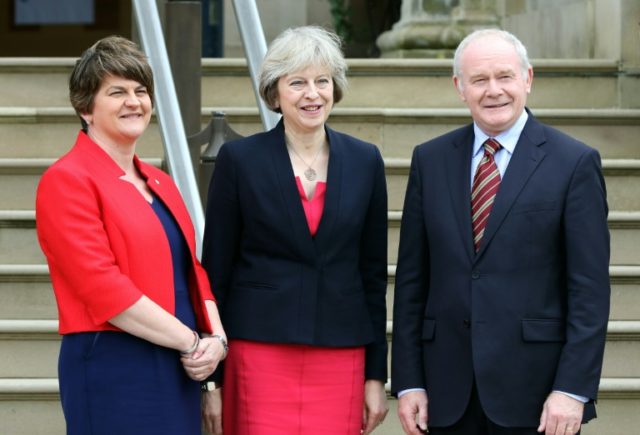 British Prime Minister Theresa May (centre) pictured alongside Northern Ireland's First Mi