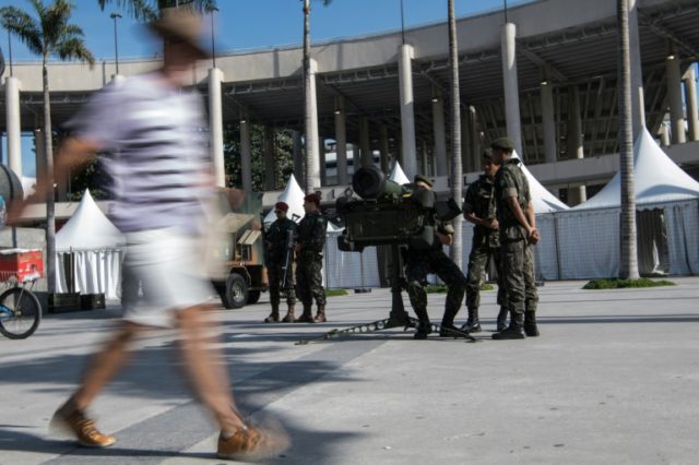 Brazilian paratroopers stand guard with an anti-aircraft missile outside the Maracana stad