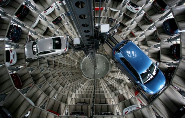 Volkswagen vehicles are seen in one of the twin car towers at the car maker's factory in W