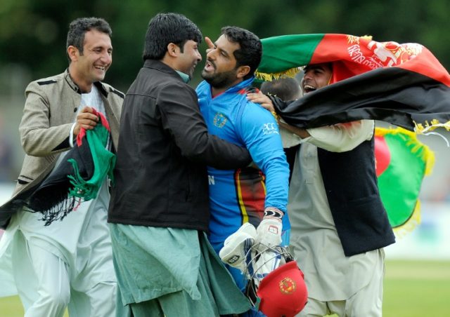 Afghanistan's Mohammad Shahzad (3rdL) celebrates with fans after Afghanistan won by 78 run