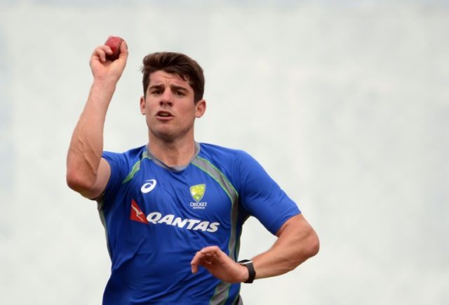 Australian cricketer Moises Henriques delivers a ball during a practice session in Palleke