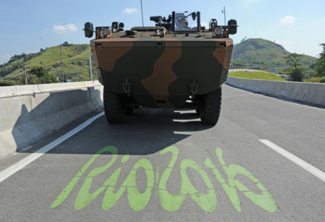 Brazilian soldiers patrol a new express road that connects Deodoro and Barra da Tijuca in