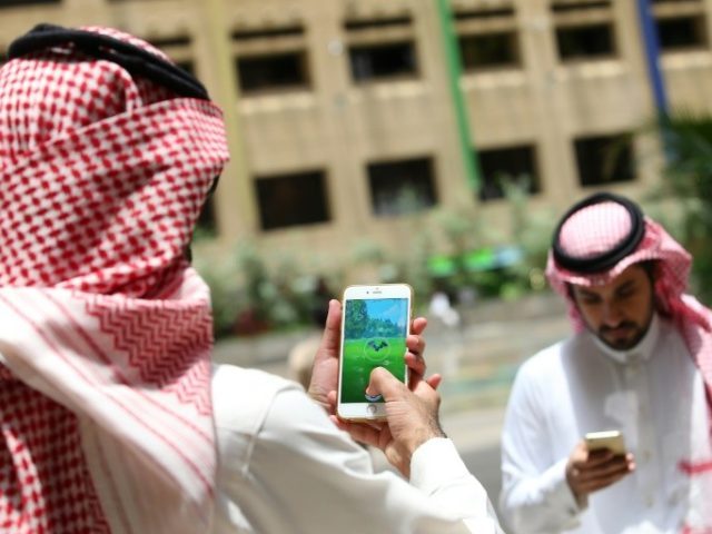 Saudi men play with the Pokemon Go application on their mobiles in the capital Riyadh on J