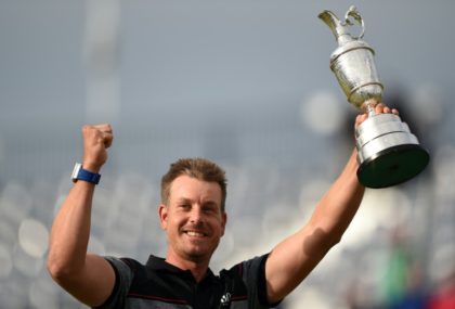 Sweden's Henrik Stenson poses for pictures with the Claret Jug at Royal Troon in Scotland