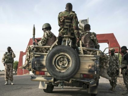 Nigerian Army soldiers prepare to leave Maiduguri in an armed convoy on the road to Damboa in Borno State, northeast Nigeria on March 25, 2016
