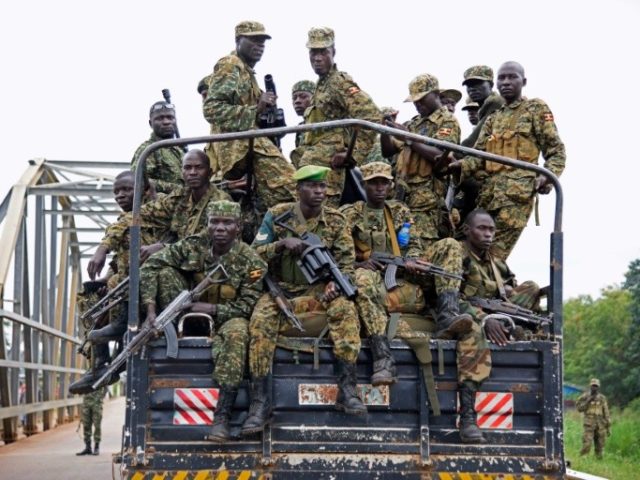 Uganda troops drive towards Juba, South Sudan, at the Nimule border point on July 14, 2016