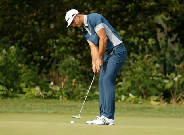 Dustin Johnson putts for birdie on the 16th green during the first round of the RBC Canadi