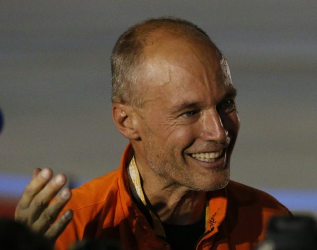 Swiss pilot Bertrand Piccard of the solar powered Solar Impulse 2 aircraft speaks to the m