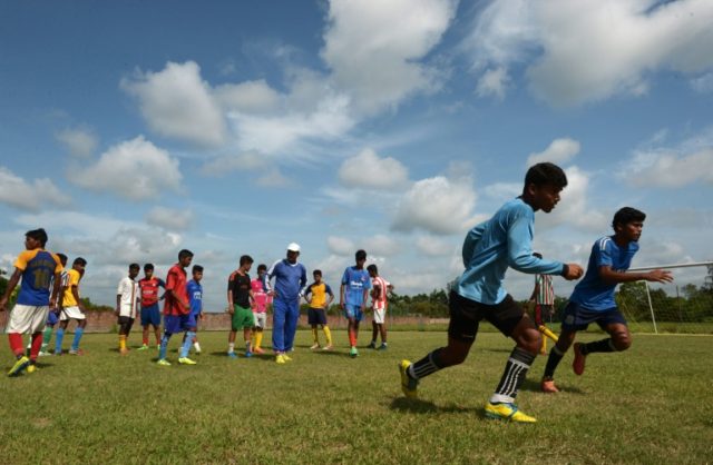 Under-privileged Indian schoolboys practice their football skills at The Durbar Sports Aca