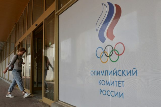 A woman enters the Russian Olympic Committee (ROC) building in Moscow on July 20, 2016