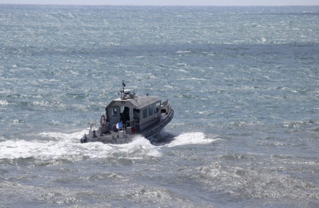 This photo taken on August 14, 2015 shows a patrol boat taking part in the search for wrec