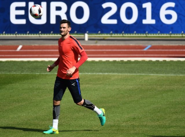 France's goalkeeper Hugo Lloris eyes the ball during a training session in Clairefontaine-