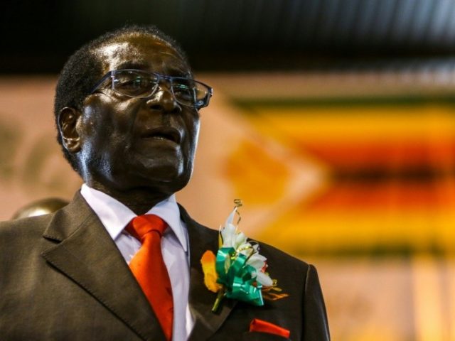 Zimbabwe's president Robert Mugabe attends a meeting with the National Liberation War Vete