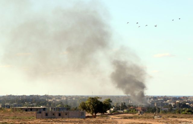 Libyan pro-government forces fire rockets targeting IS group positions in Sirte on July 18