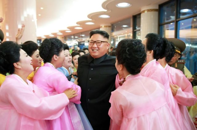 Performers greet North Korean leader Kim Jong-Un after performances by the amateur art gro