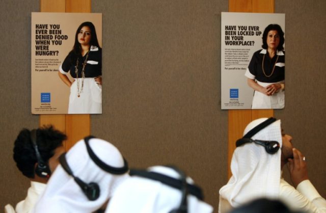 Journalists attend a press conference in Kuwait City on the abuse of domestic workers