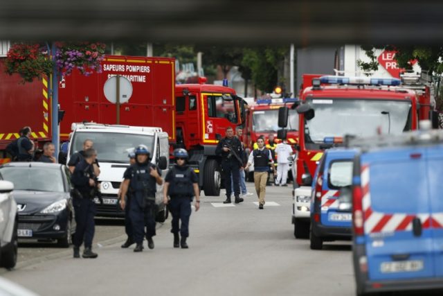 Police officers and fire services arrive at the scene of a hostage-taking at a church in S