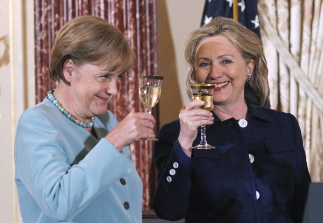 German Chancellor Angela Merkel and Secretary of State Hillary Rodham Clinton make a toast during a State Luncheon in honor of the German chancellor, Tuesday, June 7, 2011, at the State Department in Washington. (AP Photo/Manuel Balce Ceneta)