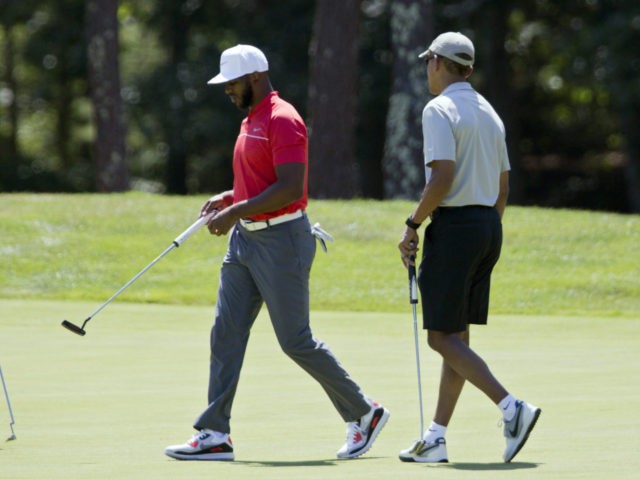 In this Aug. 7, 2016, photo, President Barack Obama and Los Angeles Clippers point guard Chris Paul walk on the first green during a round of golf at Farm Neck Golf Course in Oak Bluffs, Mass., on Martha's Vineyard. When Obama goes on vacation, he plays a lot of golf. …