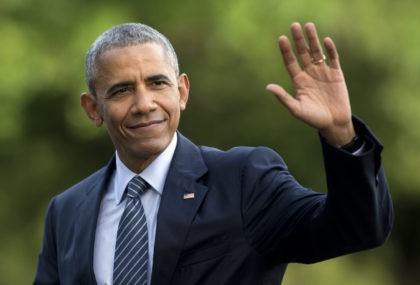 FILE - In this July 5, 2016 photo, President Barack Obama waves as he walks across the South Lawn of the White House, in Washington, as he returns from Charlotte, N.C. where he participated in a campaign event with Democratic presidential candidate Hillary Clinton. Obama is interrupting his summer vacation …