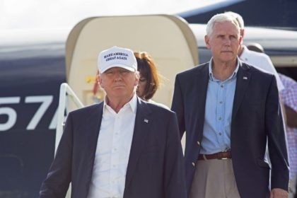 Republican presidential candidate Donald Trump, followed by his running mate, Indiana Gov.