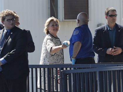 Democratic presidential candidate Hillary Clinton greets people as she arrives at Provincetown Municipal Airport in Provincetown, Mass., Sunday, Aug. 21, 2016. Clinton is traveling to a fundraiser at the Pilgrim Monument and Provincetown Museum in Provincetown. (AP Photo/Carolyn Kaster)
