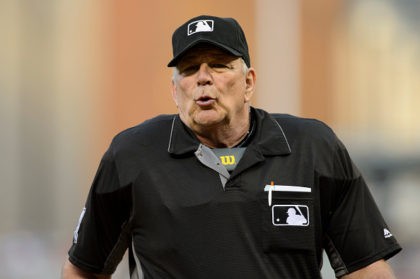 MINNEAPOLIS, MN - JULY 01: Home plate umpire Bob Davidson #61 looks on during the game bet