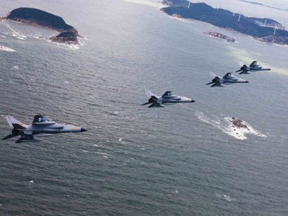 China : JH-7 fighter-bombers of the Jinan Military Region of Chinas PLA Air Force fly over islands during a combat training, 4 September 2012. China is stepping up live-ammunition combat trainings over island dispute with Japan.
