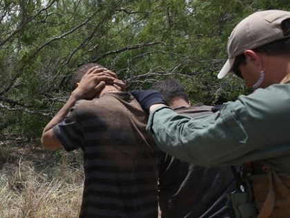 FALFURRIAS, TX - JULY 23: U.S. Border Patrol agents detain undocumented immigrants in den