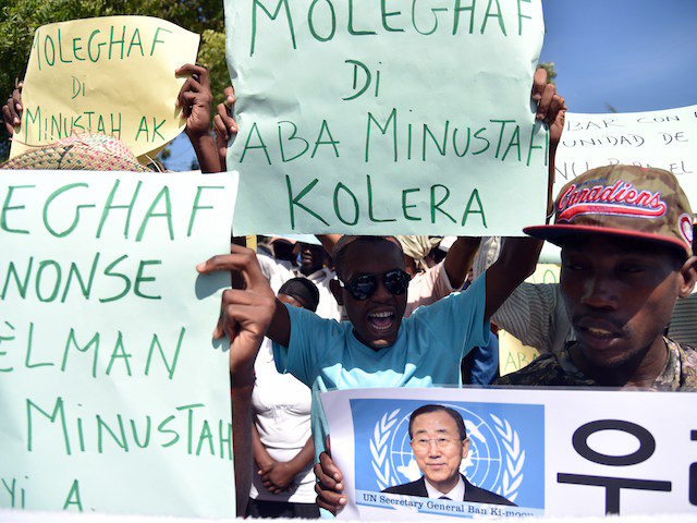 Haitian human rights and victims of cholera in Haiti rally in front of the Log Base of Minustah (United Nations Stabilization Mission in Haiti), in Port-au-Prince, on October 15, 2015, to demand justice and reparation. The Caribbean country's cholera outbreak started in 2010 and more than 8,850 people died. AFP …