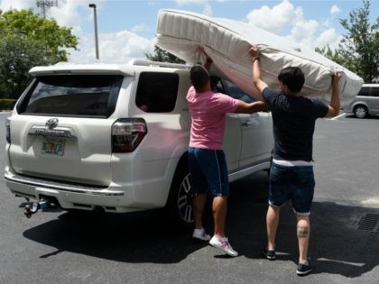 Venezuelan immigrants collect donations from Venezuela Awareness, a foundation created to help Venezuelan immigrants, at a storage facility in Miami, Florida, on June 03, 2016. Since early 2014, Venezuela has been among the top 10 asylum-seeking nations in the US. 'The foreign-born population of Venezuelan origin living in the US …
