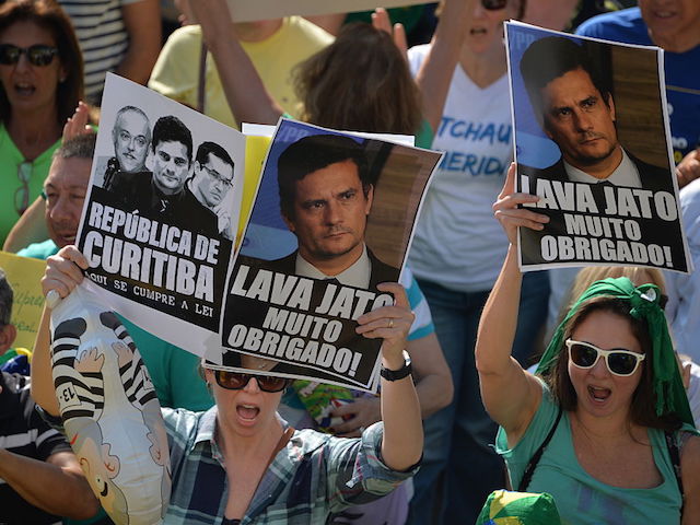 Hundreds of people hold a protest against suspended president Dilma Rousseff in Sao Paulo, on July 31, 2016. Protesters took to the streets of Brazil on Sunday to demand the final leaving of suspended President Dilma Rousseff or to defend her continuance, just five days before the start of the Rio 2016 Olympic Games. / AFP / NELSON ALMEIDA (Photo credit should read NELSON ALMEIDA/AFP/Getty Images)