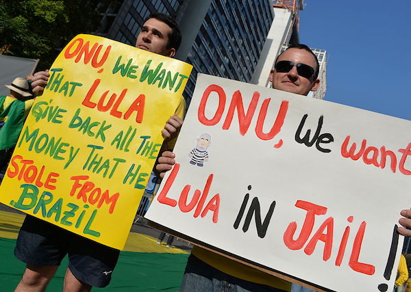 People take part in a protest against suspended president Dilma Rousseff in Sao Paulo, on July 31, 2016. Protesters took to the streets of Brazil on Sunday to demand the final leaving of suspended President Dilma Rousseff or to defend her continuance, just five days before the start of the Rio 2016 Olympic Games. / AFP / NELSON ALMEIDA (Photo credit should read NELSON ALMEIDA/AFP/Getty Images)