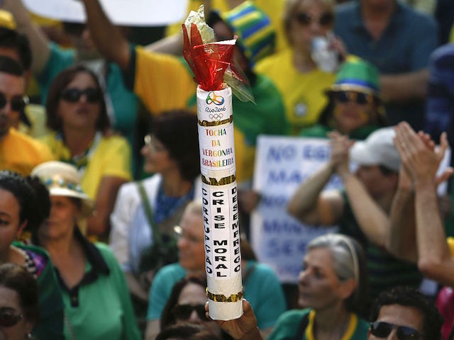 Activists protest against suspended president Dilma Rousseff in Sao Paulo, Brazil on July 31, 2016. Protesters took to the streets of Brazil on Sunday to demand the final leaving of suspended President Dilma Rousseff or to defend her permanence, just five days before the start of the Rio 2016 Olympic Games. / AFP / Miguel Schincariol (Photo credit should read MIGUEL SCHINCARIOL/AFP/Getty Images)