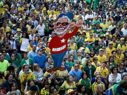 Activists protest against suspended president Dilma Rousseff in Sao Paulo, Brazil on July 31, 2016. Protesters took to the streets of Brazil on Sunday to demand the final leaving of suspended President Dilma Rousseff or to defend her permanence, just five days before the start of the Rio 2016 Olympic …