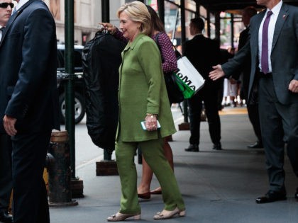 NEW YORK, NY - AUGUST 18: Democratic presidential candidate Hillary Clinton is escorted to her motorcade by U.S. Secret Service agents as she leaves a private meeting at the Sheraton Times Square Hotel, August 18, 2016 in New York City. Earlier in the day, Clinton met with law enforcement officials …