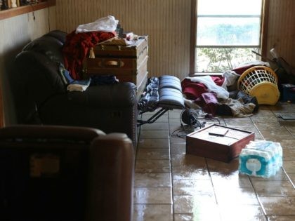 A living room is seen after flood waters inundated it on August 19, 2016 in St Amant, Louisiana. Last week Louisiana was overwhelmed with flood water causing at least thirteen deaths and thousands of homes damaged by the flood waters. (Photo by
