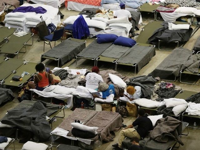 Evacuees take advantage of the shelter setup in the The Baton Rouge River Center arena as the area deals with the record flooding that took place causing thousands of people to seek temporary shelter on August 19, 2016 in Baton Rouge, Louisiana. Last week Louisiana was overwhelmed with flood water …