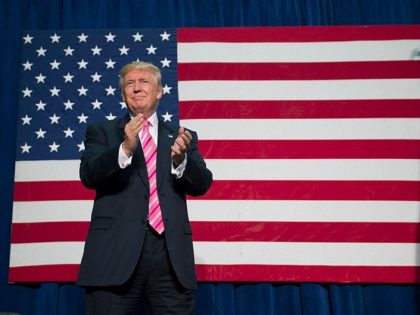 Republican presidential nominee Donald Trump takes the stage for a campaign event at Frede