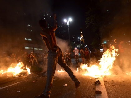 Supporters of suspendend president Dilma Rousseff holding a demonstration during her impeachment trial set trash bags on fire as police fire tear gas grenades at them, in Sao Paulo Brazil on August 29, 2016. Rousseff who testified for the first time at her trial urged the Senate to vote against …