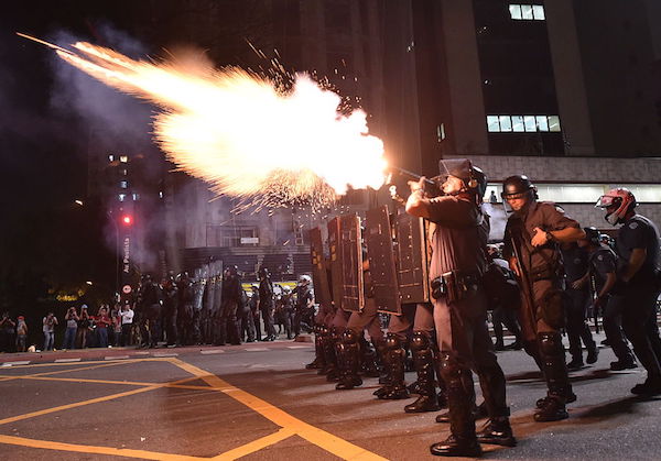 Police fire tear gas grenades at supporters of suspendend president Dilma Rousseff holding a demonstration during her impeachment trial in Sao Paulo, Brazil on August 29, 2016. Rousseff who testified for the first time at her trial urged the Senate in Brasilia to vote against impeaching her denying charges that she fiddled government accounts. / AFP / NELSON ALMEIDA (Photo credit should read NELSON ALMEIDA/AFP/Getty Images)